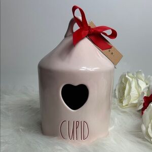 Rae Dunn Soft Pink CUPID Birdhouse with Red Bow and Heart cutout in front.💘
